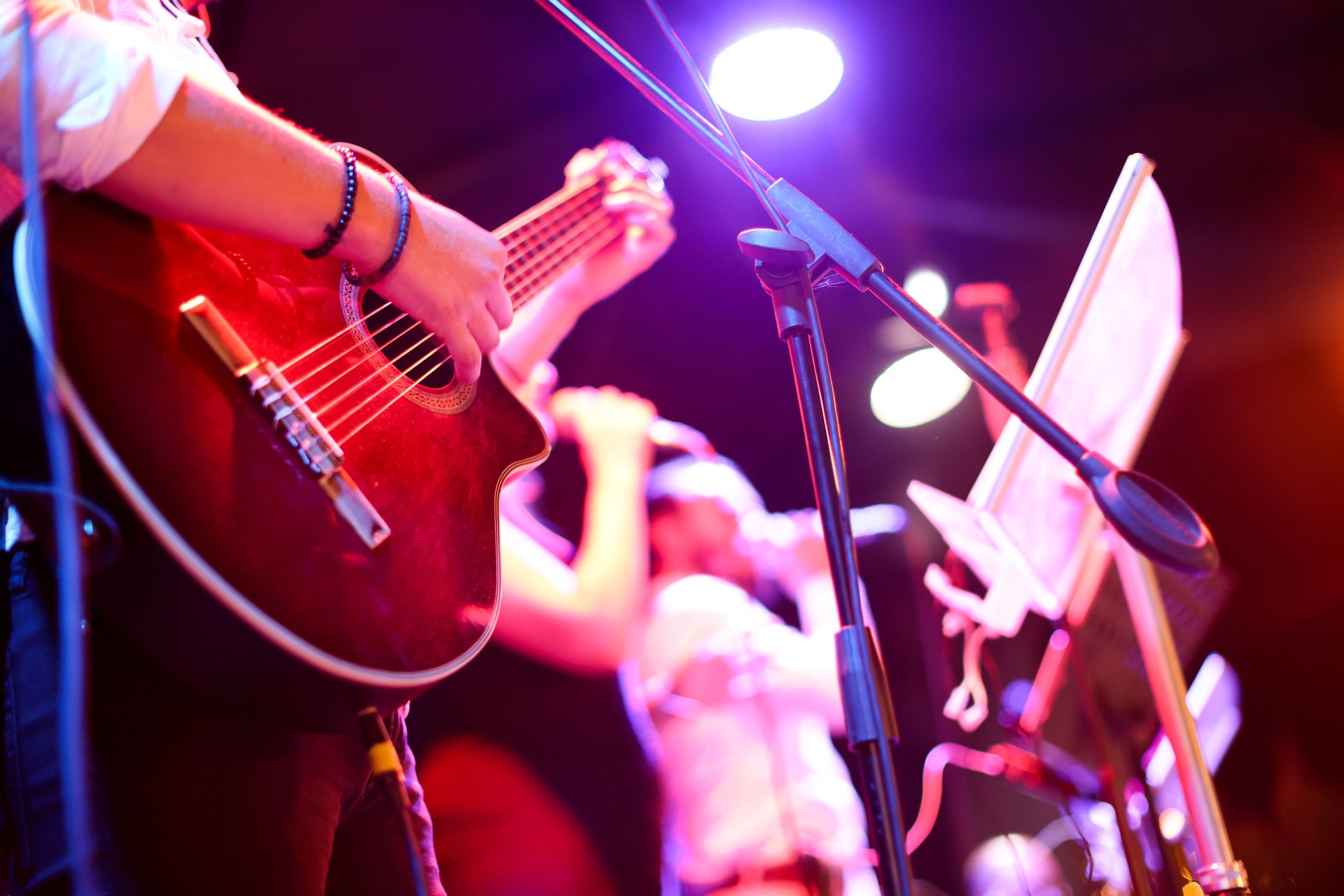 Guitarist on stage for background, soft and blur concept